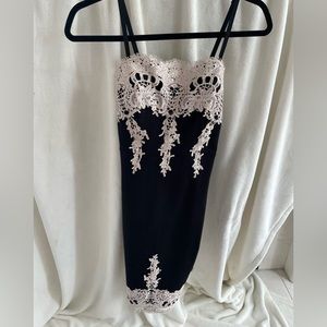 Black fitted-midi dress in medium. Never worn.